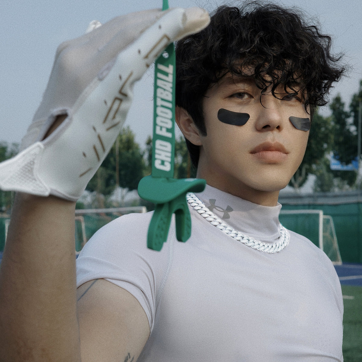 Real CHD mouthguard player photo — square composition — chd air 2 0 green football mouthguard