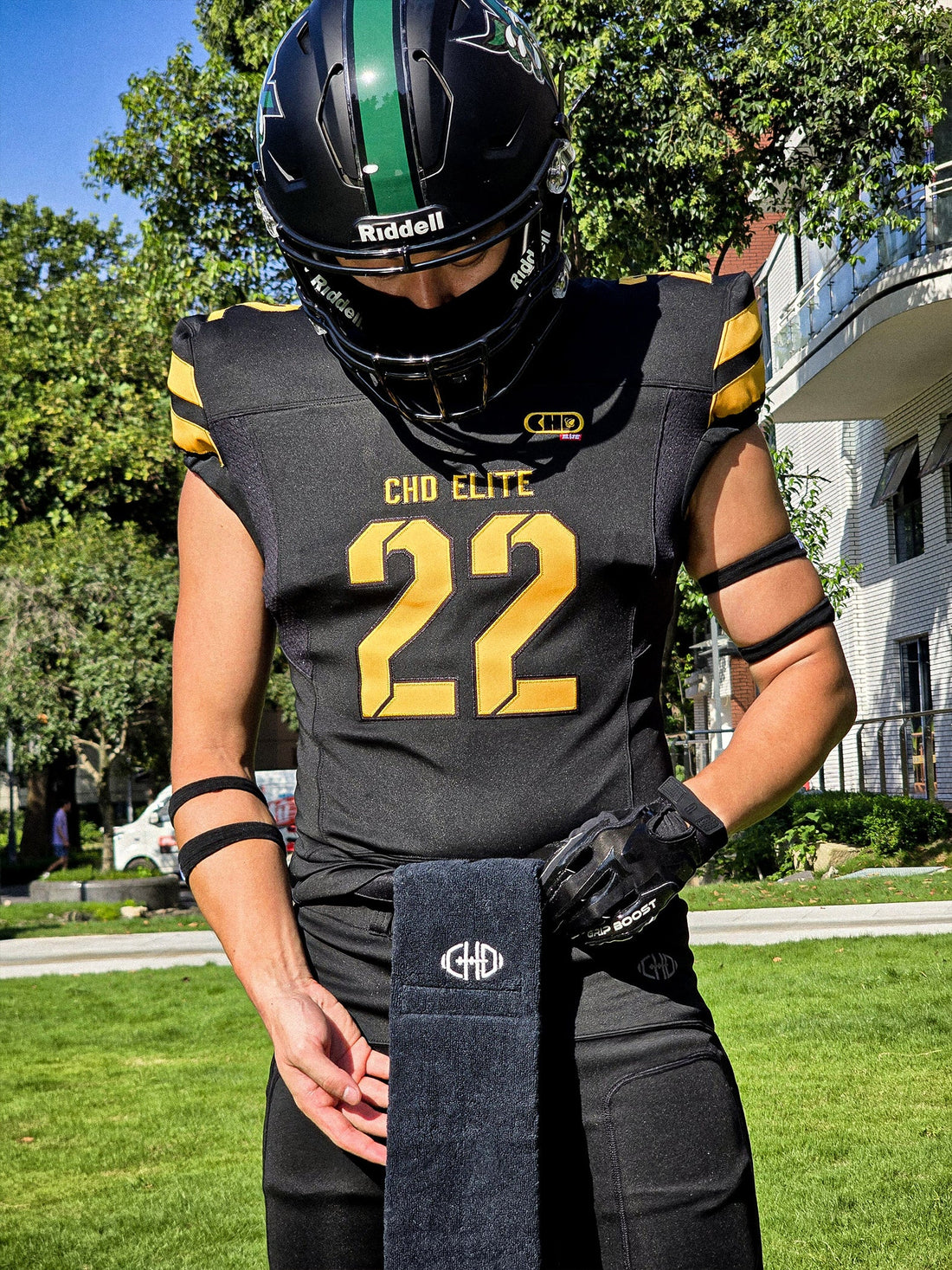 Front of black football jersey with yellow number 22 and shoulder accents