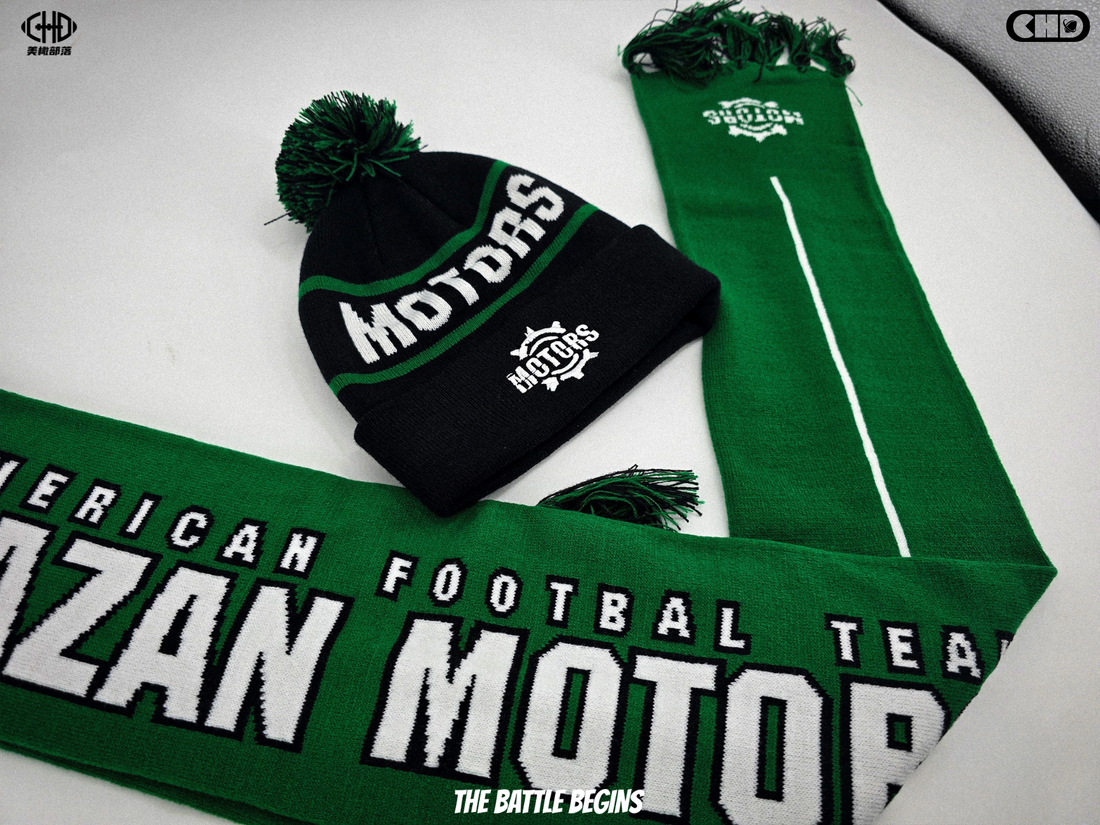 Black and green pom beanie with MOTORS lettering beside a matching scarf