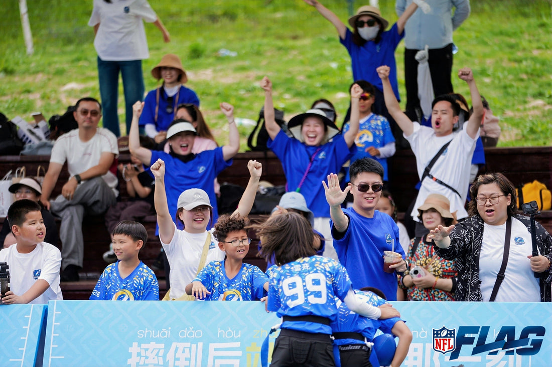 Dalian youth flag football team and supporters in blue Great White Sharks apparel
