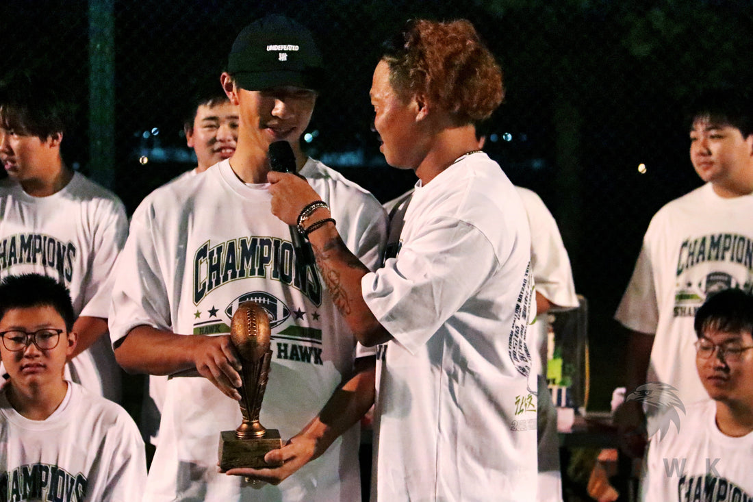 Shanghai Ying Football Club members wearing white graphic team T-shirts