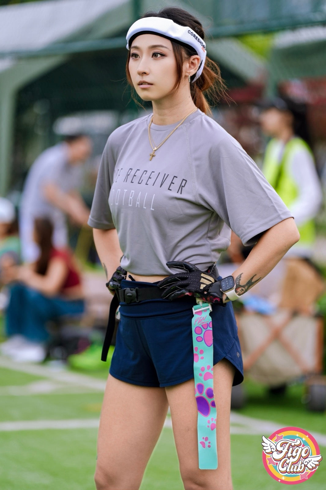 White football headband worn in a flag football field setting