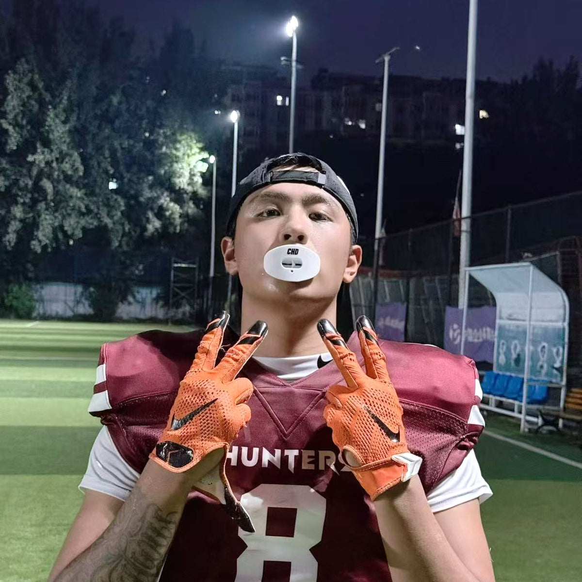 Real CHD mouthguard player photo — square composition — chd air 2 0 white football mouthguard
