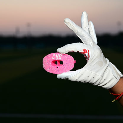 Real CHD mouthguard player photo — square composition — chd diamond pink on pink football mouthguard