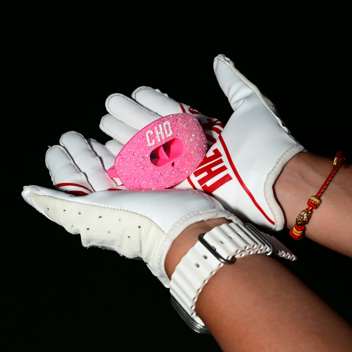 Real CHD mouthguard player photo — square composition — chd diamond pink on pink football mouthguard