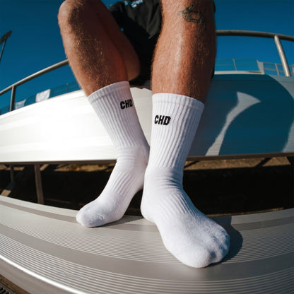 White CHD crew socks worn on stadium seating