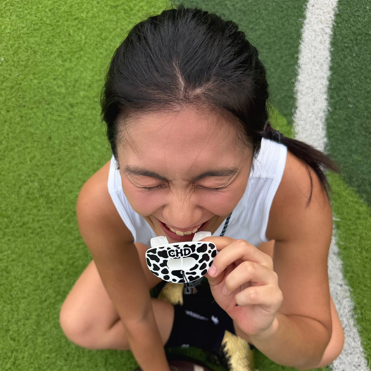 Real customer photo of CHD Cow Print Design Football Mouthguard; square crop from original CHD photo